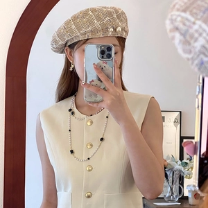 Elegant layered pearl necklace with diamond accents and matching tweed pearl beret set