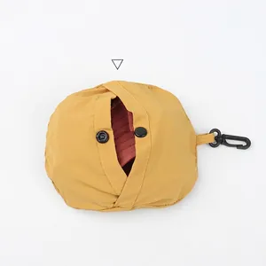 Portable yellow quick-dry sun hat storage bag with black snap hook for hiking