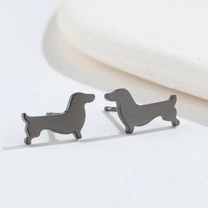 Macro shot of minimalist black dachshund dog stud earrings in polished stainless steel finish
