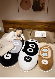 Cozy scenario of a person sleeping with a long cat plush pillow featuring GOOD text