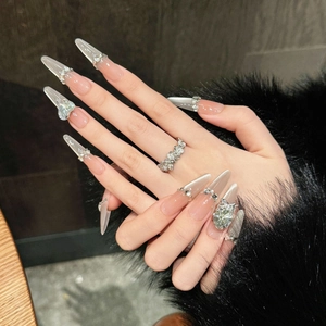 French cat eye press-on nails with luxury rhinestones and a floral ring detail