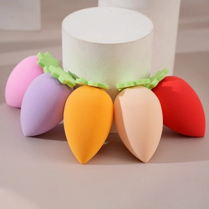 Fan-shaped arrangement of strawberry makeup sponges in diverse soft pastel colors