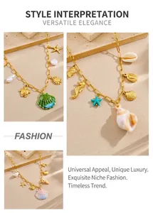 Detail of gold beach necklaces with enamel starfish, seahorse and turtle charms