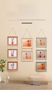 Hanging wooden photo frame set with natural jute rope in rustic minimalist style