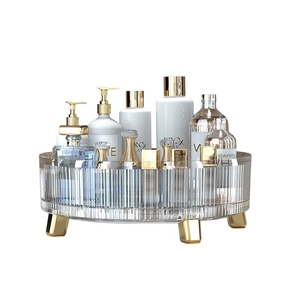 Rotating clear cosmetic organizer tray with gold feet for vanity and kitchen storage
