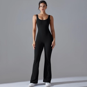 Sleeveless black yoga jumpsuit featuring a scoop neck and flared yoga pants design