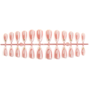 French white almond press-on nails with gold star accents on a 24-piece display