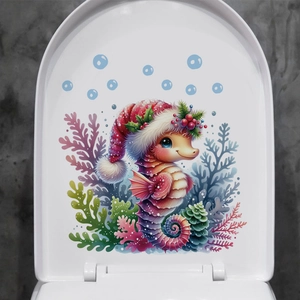 Détail d'un sticker de Noël hippocampe avec corail sur un couvercle de toilette