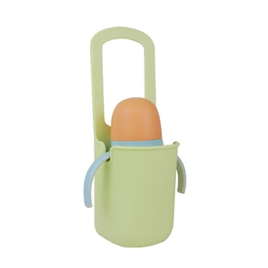 Close-up of a light green silicone cup holder with a baby bottle on a white background