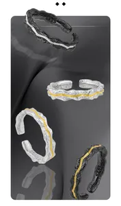 Detailed macro view of S925 sterling silver rings with irregular rock lava texture