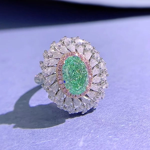 Luxurious 925 silver ring featuring an oval green gem surrounded by pink and white diamonds