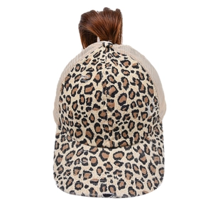 Detail of high ponytail opening on a leopard print mesh baseball cap with frayed edges