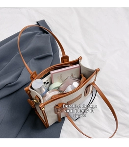 Top view of spacious interior of canvas tote bag showing daily essentials for commuting