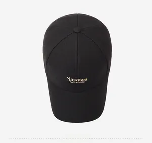 Detailed top view showing Narason FASHIONES gold embroidery on black cotton baseball cap