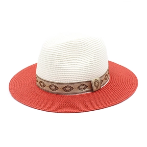 Detail of two-tone panama hat with red brim and geometric pattern jacquard ribbon
