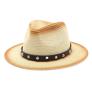 Detail of gradient straw fedora hat featuring black leather belt with silver punk rivets