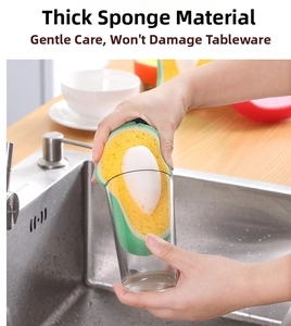 Thick avocado-shaped cleaning sponge scrubbing a clear glass cup in a kitchen sink
