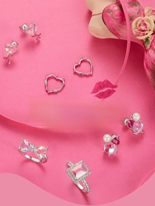 Macro shot of S925 sterling silver heart earrings and Barbie style jewelry set