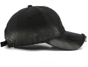 Detail of distressed black baseball cap with vintage stone-washed fabric and ripped edges