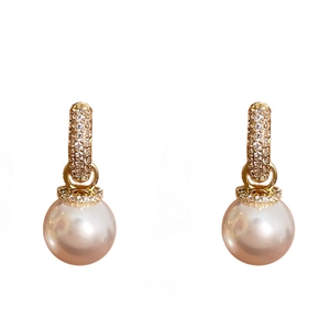 Elegant gold plated round huggie earrings with white pearls and sparkling zircon accents