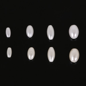 Detail view of oval imitation pearls in four sizes for DIY jewelry making