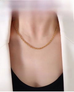 Close-up of 3.2mm gold-plated stainless steel Rolo chain on woman's neck