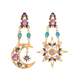 Close-up of asymmetric sun and moon drop earrings with multicolored crystals