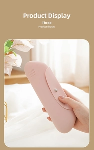 Silicone makeup brush storage bag detail view, portable pink travel cosmetic pouch with snap button.
