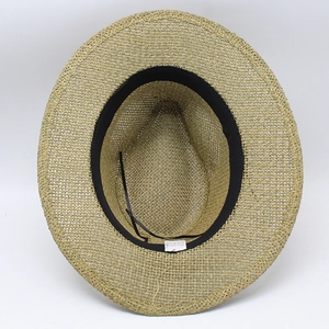 Detail of hand-woven paper straw hat showing inner black sweatband and adjustable drawstring
