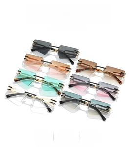 Close-up of rimless geometric sunglasses with metal temples in multiple gradient colors
