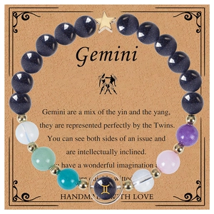 Detail of Gemini zodiac bracelet with blue goldstone and multi-colored beads on display card