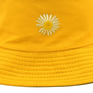 Fashionable bright yellow cotton bucket hat with daisy embroidery and reinforced brim