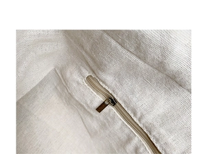 Detail of nylon tote bag interior with woven texture lining and a secure zipper pocket