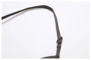 Close-up of seamless ribbed yoga set featuring adjustable straps and metal hardware