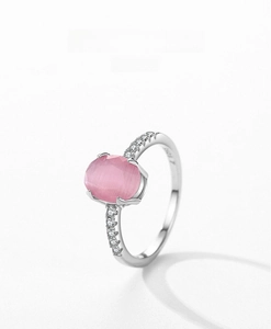 Close-up of S925 sterling silver ring featuring a pink cat eye stone and side zircons