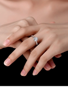 Close-up of S925 sterling silver crown ring with a 1-carat moissanite stone on hand