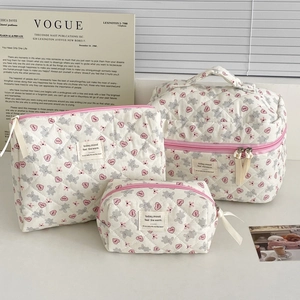 Three-piece quilted cosmetic bag set featuring grey rabbit and pink heart cartoon prints