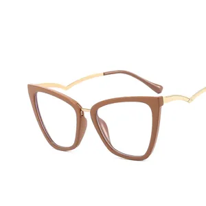 Brown cat eye glasses with gold metal temples and blue light blocking lenses