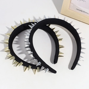 Punk style black velvet headband featuring sharp gold and silver metal rivets spikes