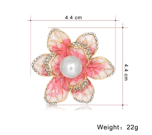 Detailed view of pink enamel flower brooch with rhinestones, pearl center and size specs