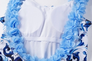 Detail of blue baroque print swimsuit with 3D applique flowers and built-in bra pads