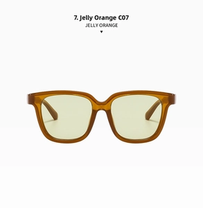Detail view of retro large frame sunglasses in translucent jelly orange finish