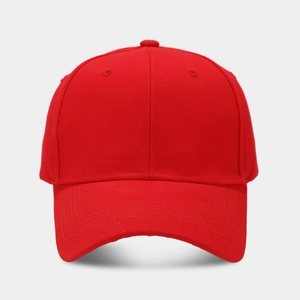 Close-up of bright red cotton twill baseball cap with six-panel stitching and vent eyelets