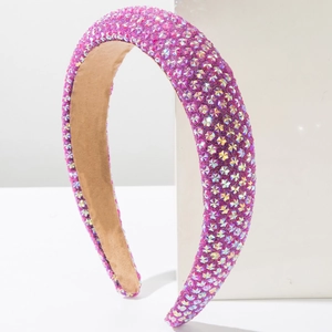 Detailed close-up of a sponge padded headband with sparkling purple rhinestones