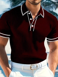 Detail of burgundy ribbed polo shirt with white contrast stripes on collar and cuffs