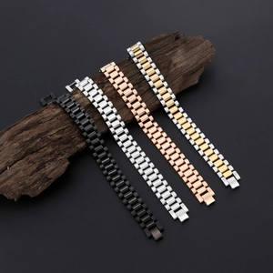 Detailed shot of four multi-color stainless steel watch-style bracelets on dark wood base