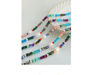 Macro view of bohemian necklace with natural stones and irregular freshwater pearls
