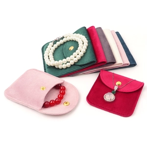 Velvet jewelry pouches with snap buttons in multiple colors for rings and necklaces