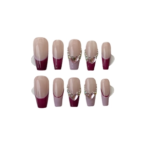 Handmade burgundy and nude press-on nails with sparkling pink heart crystal accents
