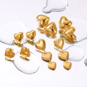 Polished 18k gold heart stud and drop earrings set with mirror-like metallic finish